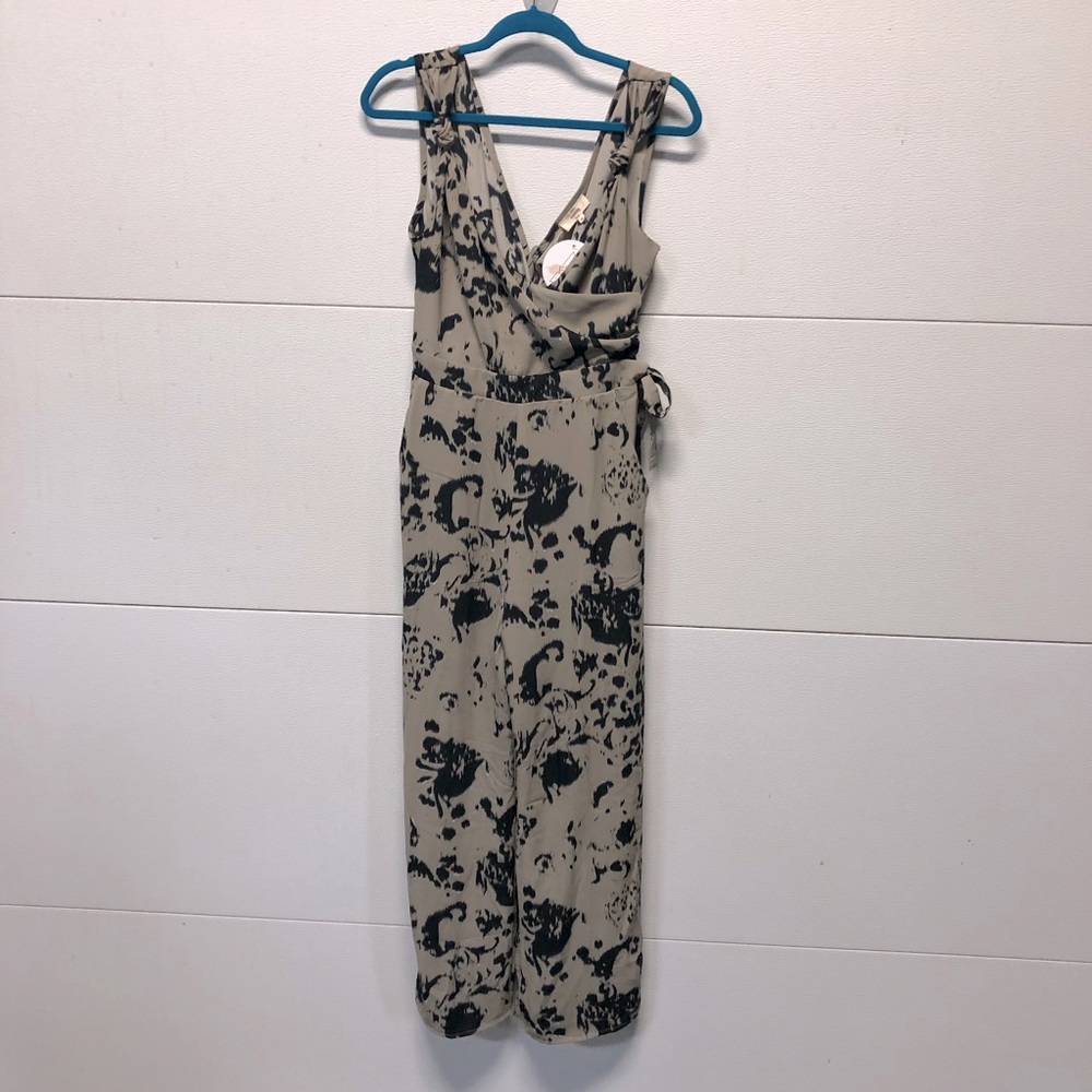 Black and taupe print sleeveless romper with pockets